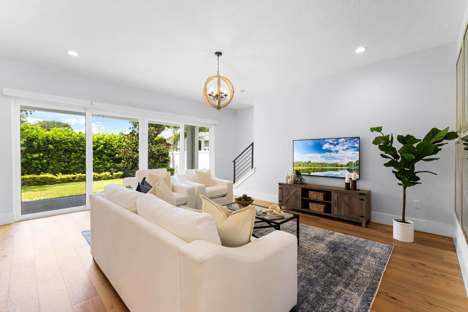 Bright living room with sliding glass doors to the backyard, a Johnson Family Homes listing